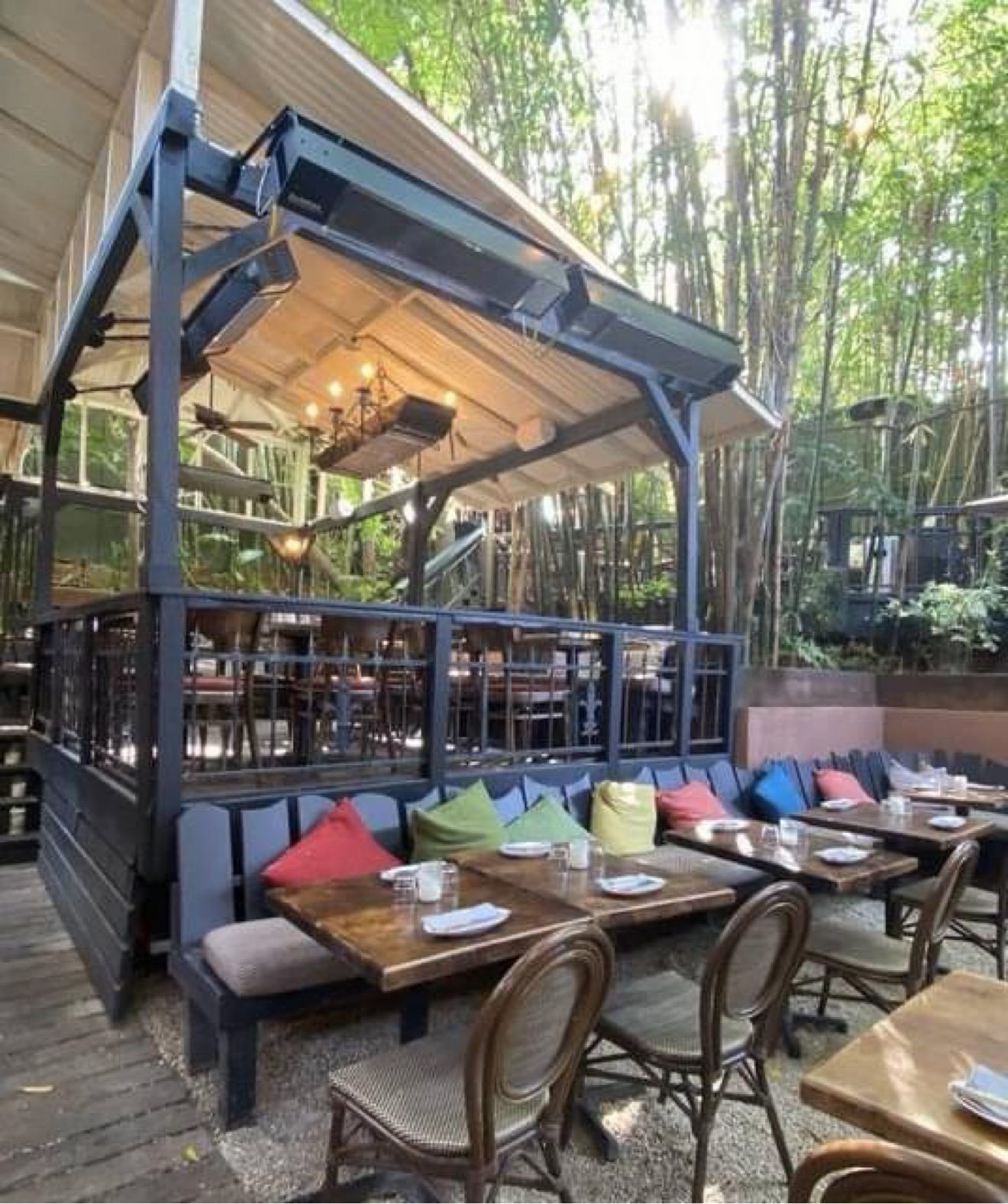 Commercial wall-mount patio heaters across a restaurant patio